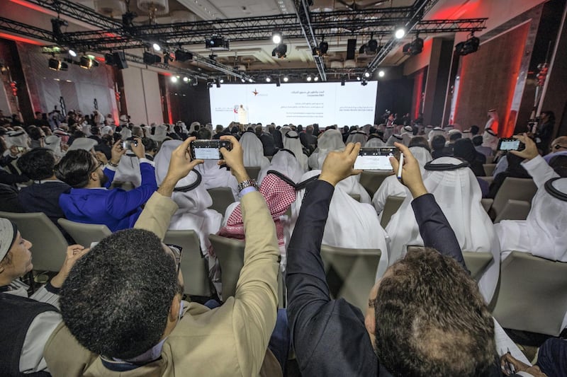 Abu Dhabi, United Arab Emirates - June 25, 2019: Two gentleman take pictures at the Abu Dhabi Private sector forum to announce a series of new initiatives developed for the private sector. Tuesday the 25th of June 2019. Saadiyat Island, Abu Dhabi. Chris Whiteoak / The National