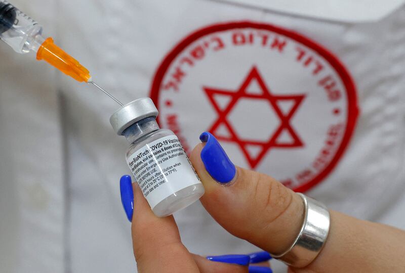An Israeli medical worker prepares a dose of the Pfizer-BioNTech Covid-19 shot.