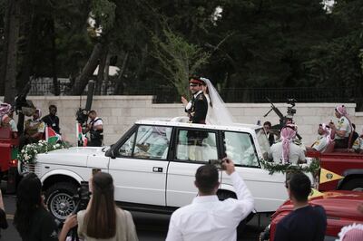 Jordan's Crown Prince Hussein and Princess Rajwa leave Zahran Palace. AP 