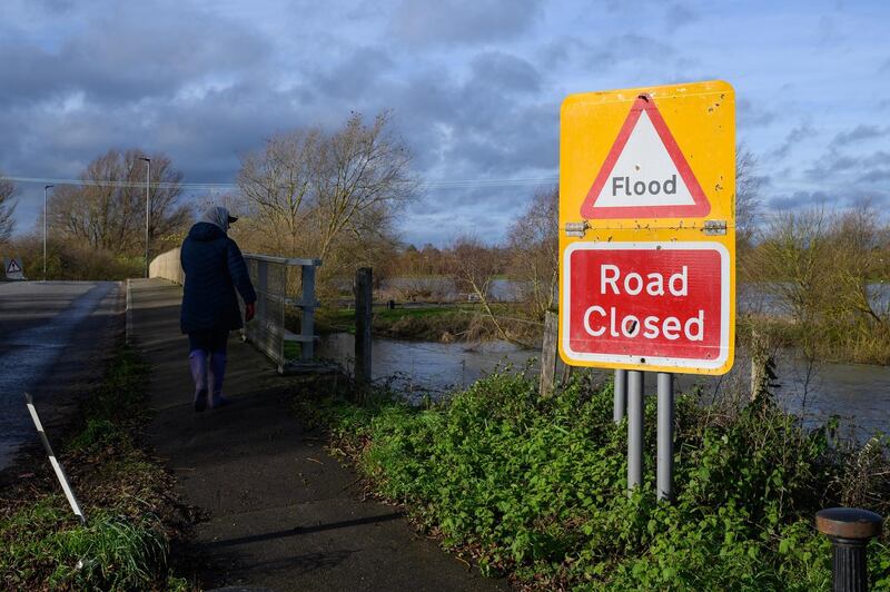 A road by the River Great Ouse is closed due to flooding in Earith. Getty Images