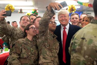US President Donald Trump and First Lady Melania Trump greet members of the US military during an unannounced trip to Al Asad Air Base in Iraq. AFP