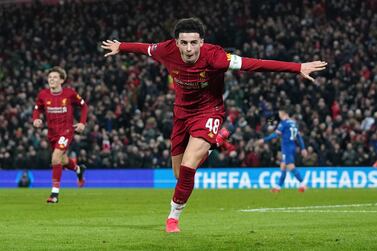 Liverpool's Curtis Jones celebrateS after Shrewsbury Town's Ro-Shaun Williams, scored an own goal during the English FA Cup Fourth Round replay soccer match between Liverpool and Shrewsbury Town at Anfield Stadium, Liverpool, England, Tuesday, Feb. 4, 2020. (AP Photo/Jon Super)