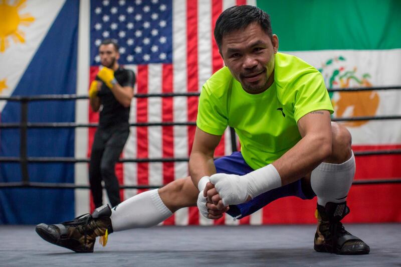 Manny Pacquiao stretches ahead of an afternoon training session at Wild Card Boxing in Los Angeles. AFP