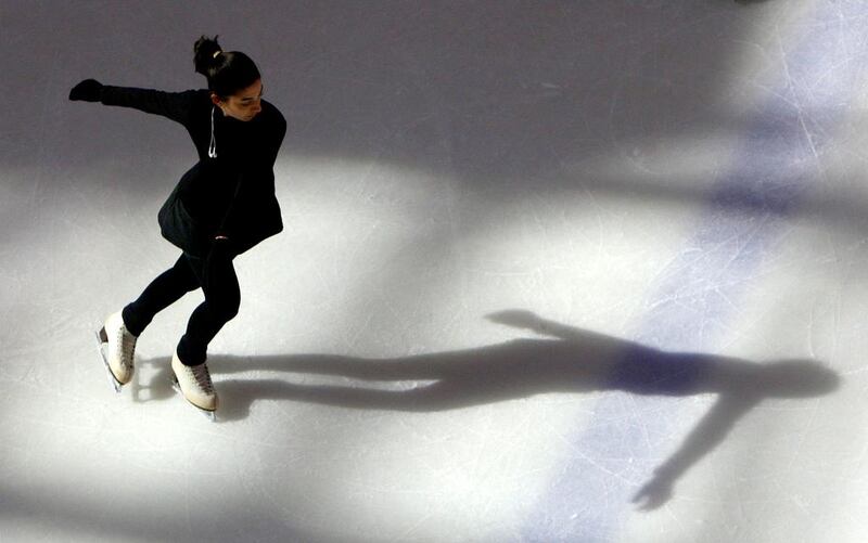 A skater enjoys ice skating in the Olympic size ice skating rink at Dubai Mall. Paulo Vecina / The National