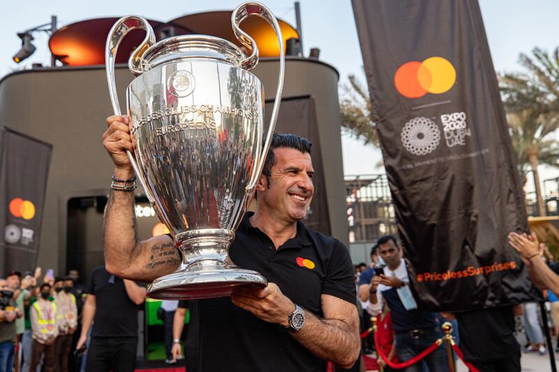 Portuguese football legend Luis Figo with the UEFA Champions League Trophy at the Mastercard Cube, Expo 2020 Dubai. Christopher Pike / Expo 2020 Dubai