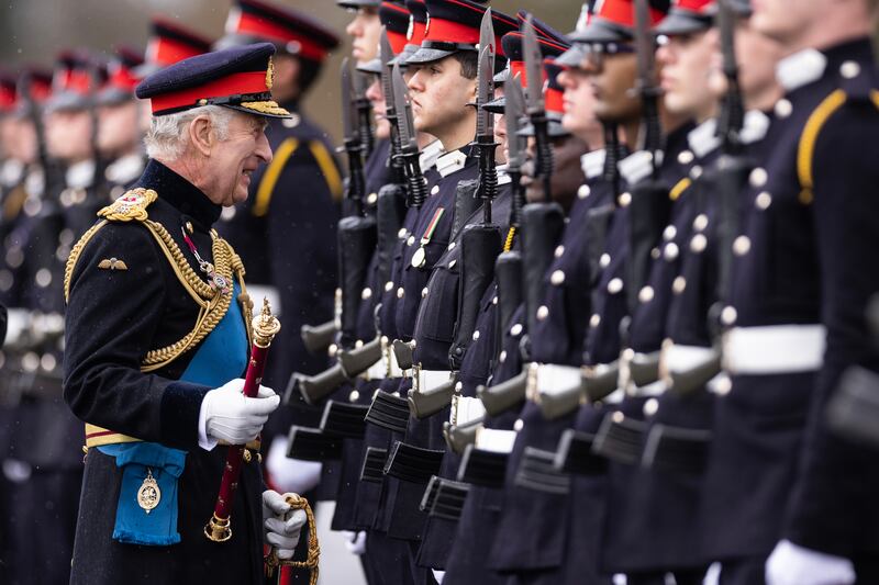 The king joked with cadets. Getty Images