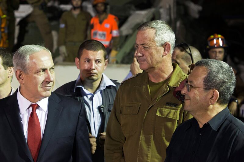FILE PHOTO: Israel's Prime Minister Benjamin Netanyahu (L), Defence Minister Ehud Barak (R) and military chief Lieutenant-General Benny Gantz (2nd R) stand together after observing an earthquake drill in Holon, near Tel Aviv, Israel October 21, 2012. REUTERS/Nir Elias/File Photo