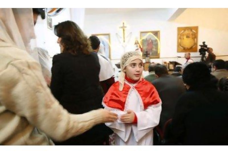 Iraqi Christians pray during an evening mass in Amman. Salah Malkawi for The National