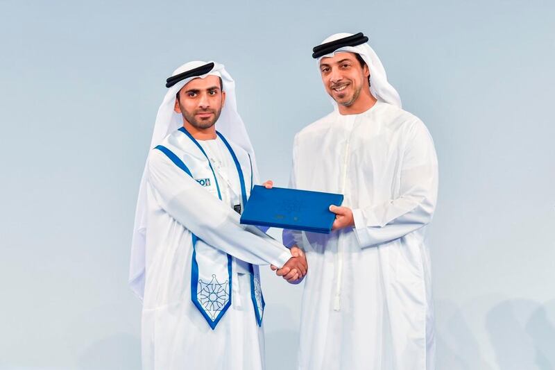 Sheikh Mansour bin Zayed, Deputy Prime Minister and Minister of Presidential Affairs, congratulates a graduating student. Courtesy Wam