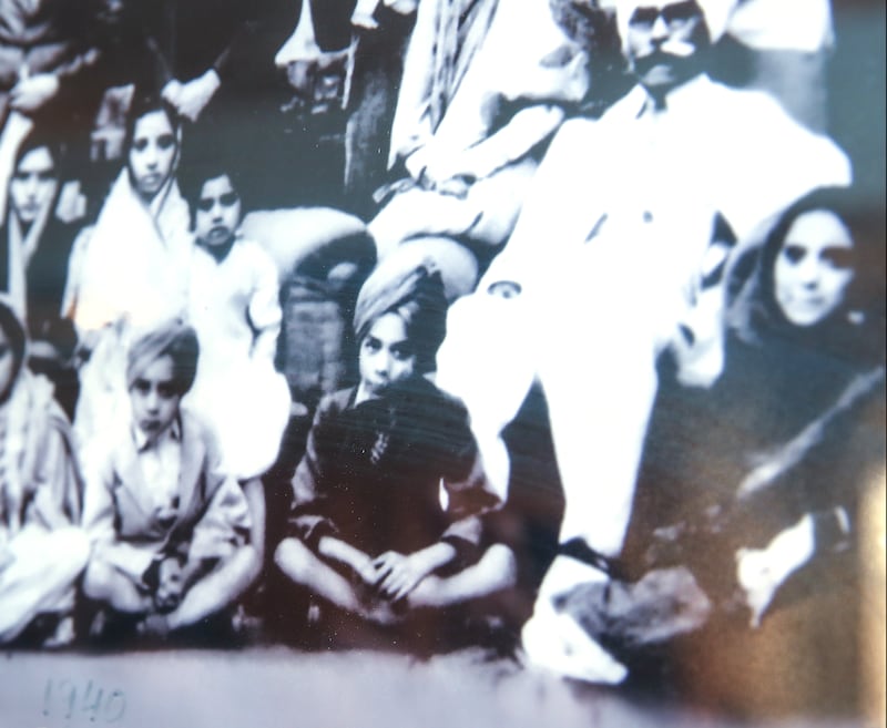 Narindra Singh Pujji, centre, at age 12 with his family. Victor Besa / The National