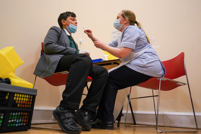 Felix Dima, 13,  receives his flu inoculation ahead of receiving a Covid-19 vaccine at the Excelsior Academy in Newcastle upon Tyne. Getty Images