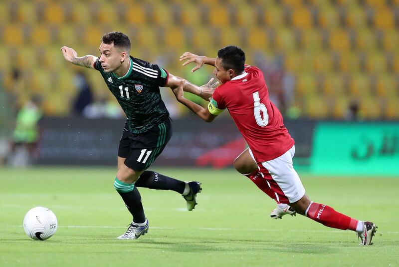 Caio Canedo of the UAE battles with Evan Dimas Darmono of Indonesia during the game between the UAE and Indonesia in the World cup qualifiers at the Zabeel Stadium, Dubai on June 11th, 2021. Chris Whiteoak / The National. 
Reporter: John McAuley for Sport