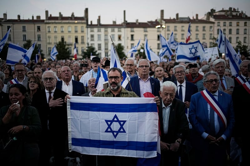 Demonstrators carrying Israeli flags gather in Lyon, France. AP