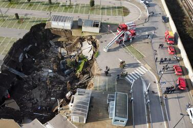 An aerial view shows a sinkhole in the Ospedale del Mare hospital car park. AFP