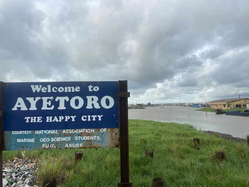 A sign welcoming visitors to the sinking 'happy' city