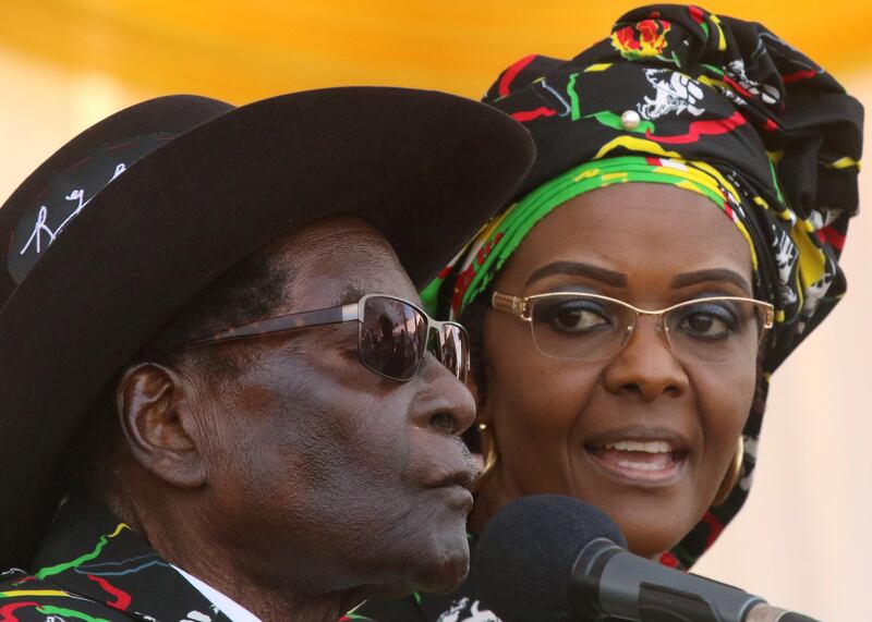 FILE PHOTO: President Robert Mugabe and his wife Grace attend a rally of his ruling ZANU (PF) in Chinhoyi, Zimbabwe July 29, 2017. REUTERS/Philimon Bulawayo/File Photo