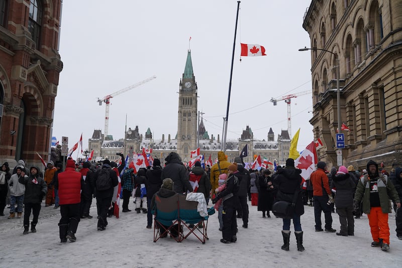 Thousands of people protest against government vaccine mandates in front of Peace Tower in Ottawa. Willy Lowry / The National.