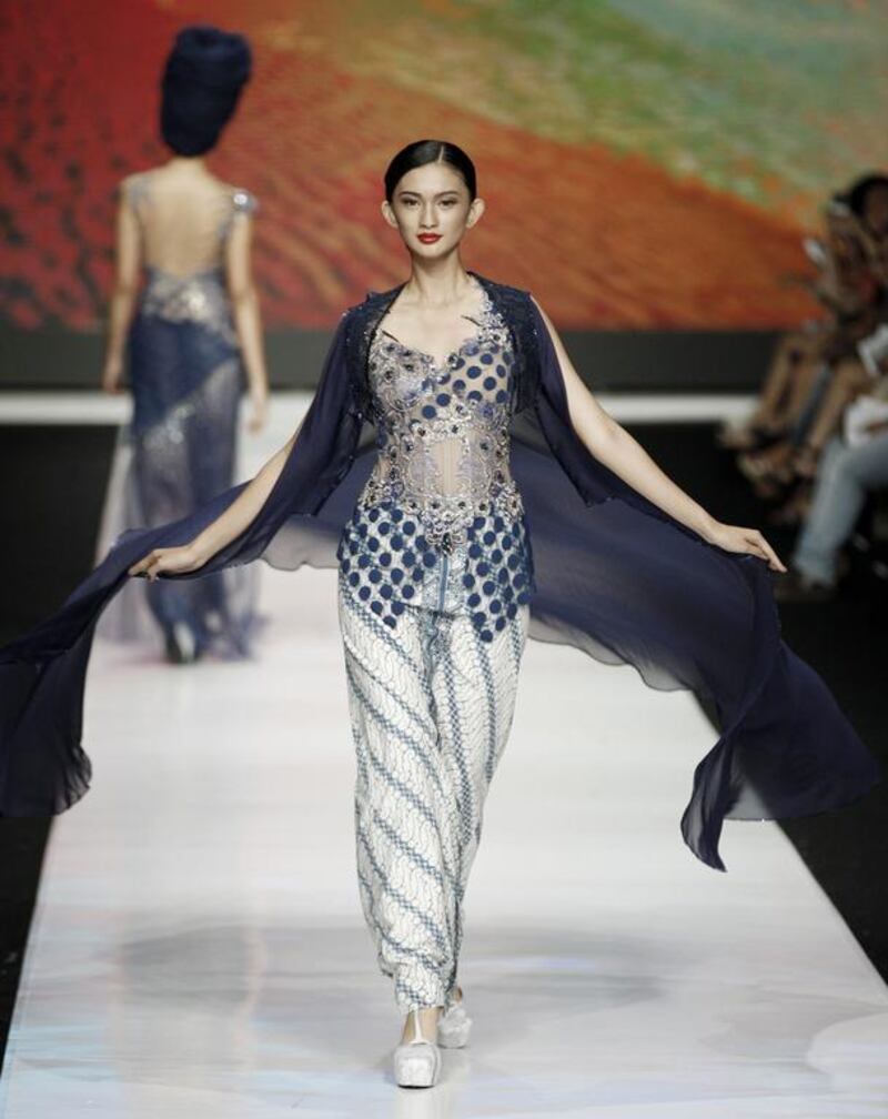 A model displays a creation by Indonesian designer Misan during the Jakarta Fashion Week in Jakarta, Indonesia. Achmad Ibrahim / AP Photo