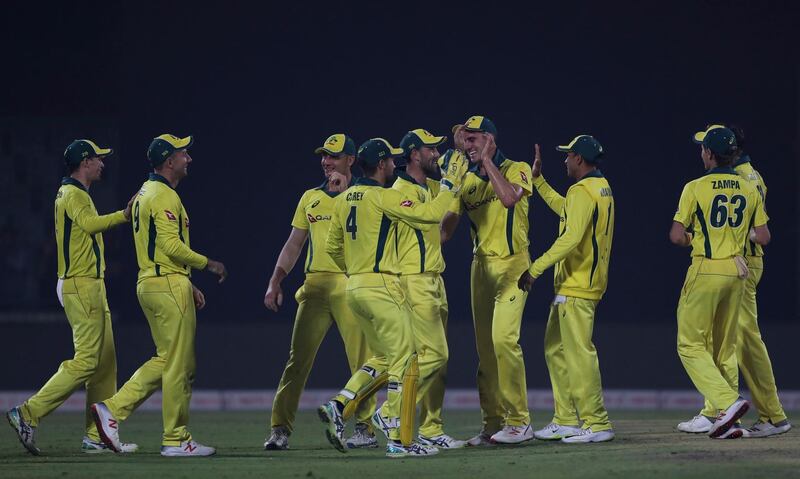Australia's players celebrate the dismissal of India's Kedar Jadhav during the final one day international cricket match between India and Australia in New Delhi, India, Wednesday, March 13, 2019. (AP Photo/Altaf Qadri)