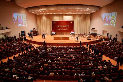 Iraqi lawmakers attend the first parliament session in Baghdad, Iraq, Monday, Sept. 3, 2018. Iraq's newly elected parliament held its first session as two blocs, both claiming to hold the most seats, vied for the right to form a new government. (AP Photo/Karim Kadim)