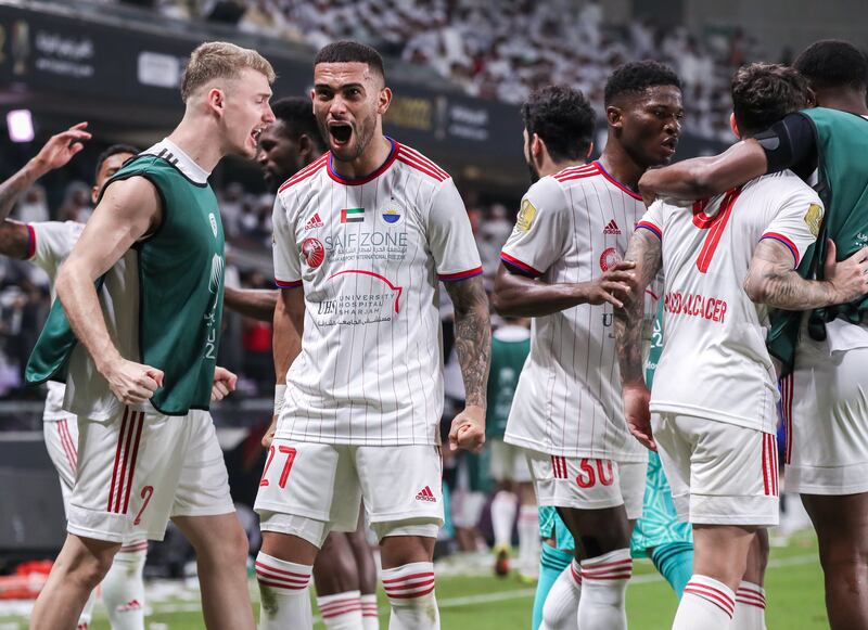 Sharjah players celebrate after Paco Alcacer scores the first and only goal of the President’s Cup final. Victor Besa / The National