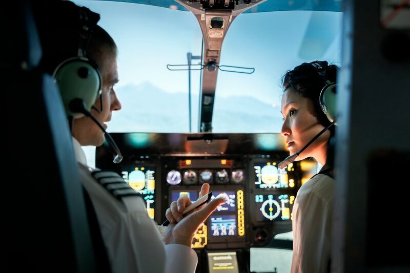 Female trainee pilot listening to an instructor during a flight simulation training. Women make up only 5 per cent of all pilots globally, according to the latest figures from industry body Iata. Getty