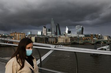 Clouds gather above skyscrapers on the skyline in the City of London. The City of London Corporation unveiled a five-year mission to reinvent the capital by 2025 with new start-up hubs, affordable work spaces, digital funds and stock exchange reforms. Bloomberg