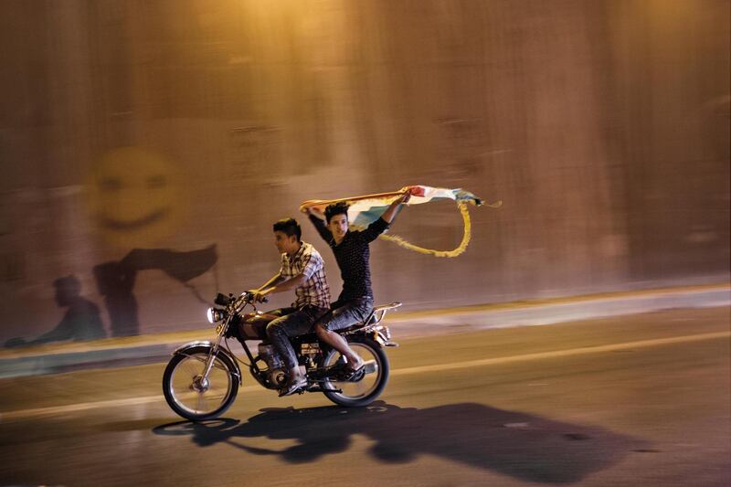 ERBIL, IRAQ: Young men drive through the streets on the eve of the Kurdish independence referendum. Photo by  Sebastian Meyer