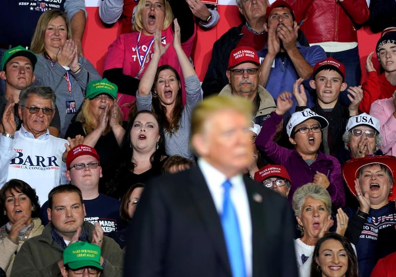 Supporters cheer U.S. President Donald Trump during a Make America Great Again rally in Richmond, Kentucky, U.S., October 13, 2018. Picture taken October 13, 2018.     REUTERS/Joshua Roberts