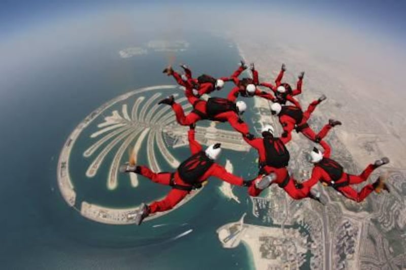 May 21, 2011-Dubai, United Arab Emirates
Members of the Red Devils parachute free fall team do a formation above the Palm in Dubai 
Courtesy Sergeant Mark Scobie 