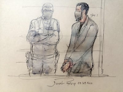 This court sketch shows Salah Abdeslam, right, flanked by a policeman. AFP