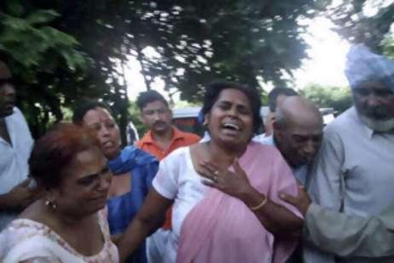 Relatives react outside Anandpur Sahib Civil hospital in the northern state of Punjab, India, where those killed and injured in the stampede were taken.