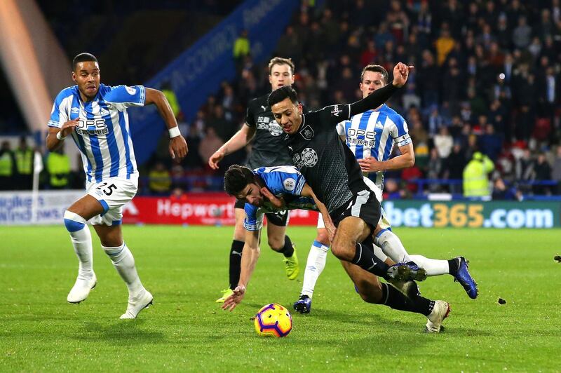 HUDDERSFIELD, ENGLAND - JANUARY 02:  Christopher Schindler of Huddersfield Town is sent of following this tackle on Dwight McNeil of Burnley during the Premier League match between Huddersfield Town and Burnley FC at John Smith's Stadium on January 2, 2019 in Huddersfield, United Kingdom.  (Photo by Alex Livesey/Getty Images)