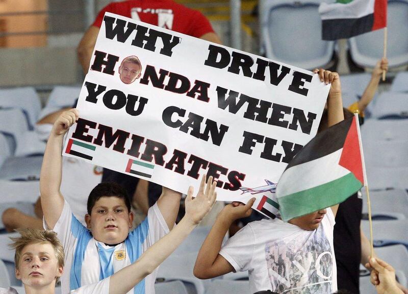 A UAE fan holds up a placard during the Asian Cup quarter-final match between the UAE and Japan on Friday in Sydney. Jason Reed / Reuters