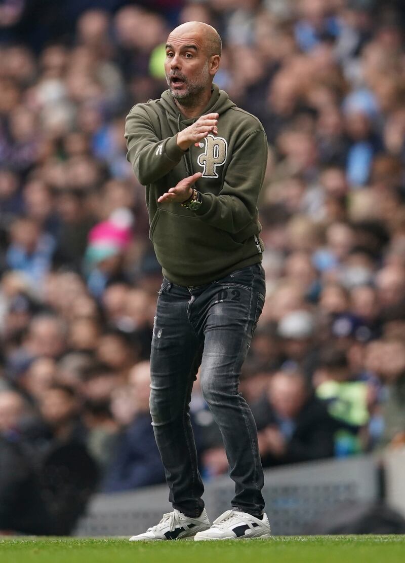 Manchester City coach Pep Guardiola gestures on the touchline. AP