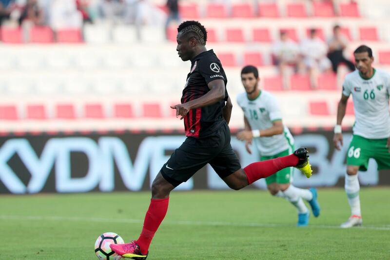 Al Ahli’s Asamoah Gyan scores from the penalty spot against Emirates during their Arabian Gulf League match in Dubai on Saturday. Christopher Pike / The National