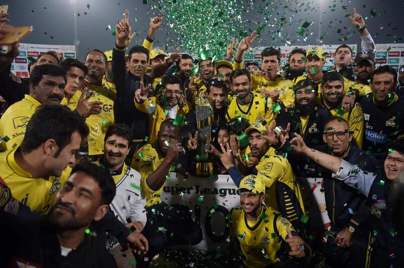 Cricketers of Peshawar Zalmi celebrate their victory over Quetta Gladiators in the final cricket match of the Pakistan Super League at Gaddafi Stadium in Lahore on Sunday. Aaamir Qureshi / AFP