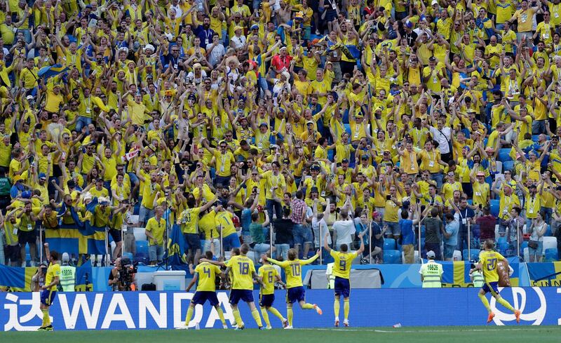 Andreas Granqvist, left, celebrates after Sweden's decisive penalty against South Korea. Lee Jin-man / AP Photo