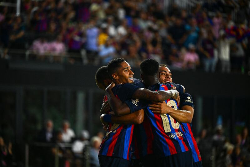 Barcelona forward Raphinha celebrates with teammates after scoring a goal during the friendly match against Inter Miami. AFP