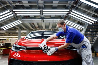 A worker assembles Volkswagen ID.5 electric cars at the company's Zwickau plant in Germany. Volkswagen is pumping $39 billion into the shift to EVs and aims to become the world's largest electric carmaker by 2025. Getty