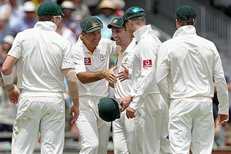 Ricky Ponting, second left, congratulates his teammates on Australia's victory over England yesterday after he had missed the final day's play because of a broken little finger.