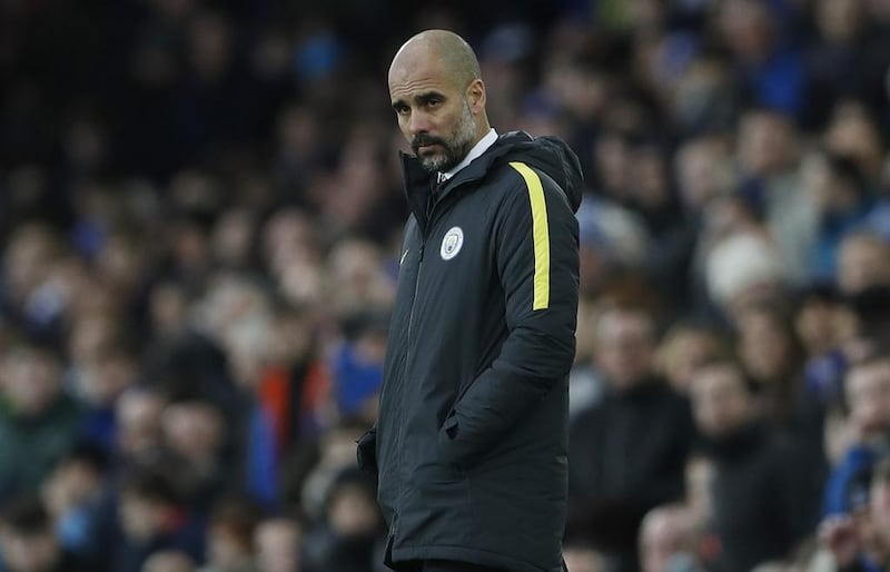 Manchester City manager Pep Guardiola looks dejected during their defeat to Everton. Lee Smith / Reuters
