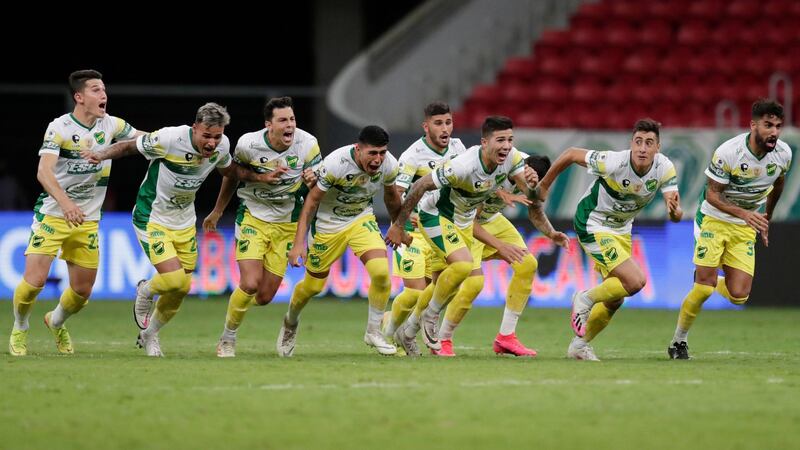Defensa y Justicia players celebrate after beating Palmeiras on penalties to win the Recopa Sudamericana at the Estadio Mane Garrincha, Brasilia, on Wednesday, April 14. Reuters