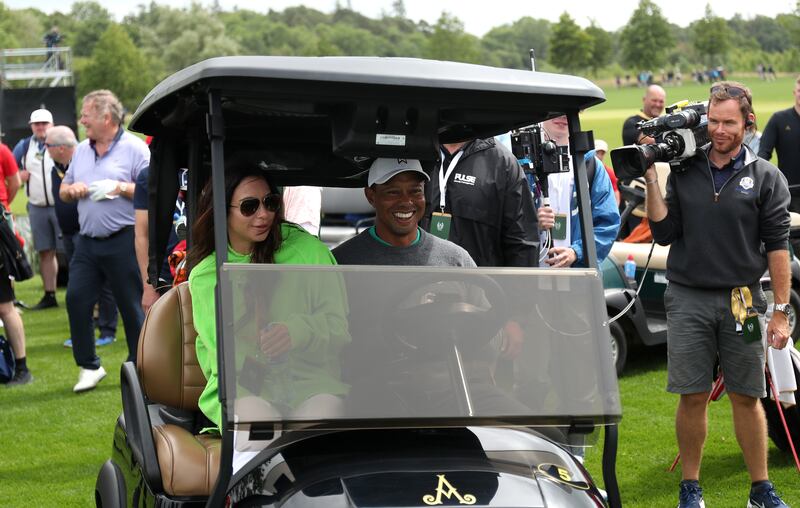 Tiger Woods of United States drives a club car to his ball. Getty Images