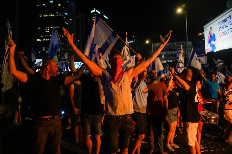 Israelis block a motorway as they protest against Prime Minister Benjamin Netanyahu's judicial reform plans. AP