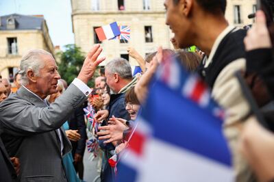 Britain's King Charles gestures as he greets the crowds in Bordeaux. Getty Images