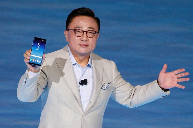 Koh Dong-jin, president of Samsung Electronics' Mobile Communications holds the Galaxy Note 8 smartphone during a launch event in New York City. Brendan McDermid / Reuters