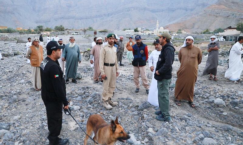 Search and rescue teams look for the body of a man who went missing in a flash flood last Saturday. Courtesy RAK Police