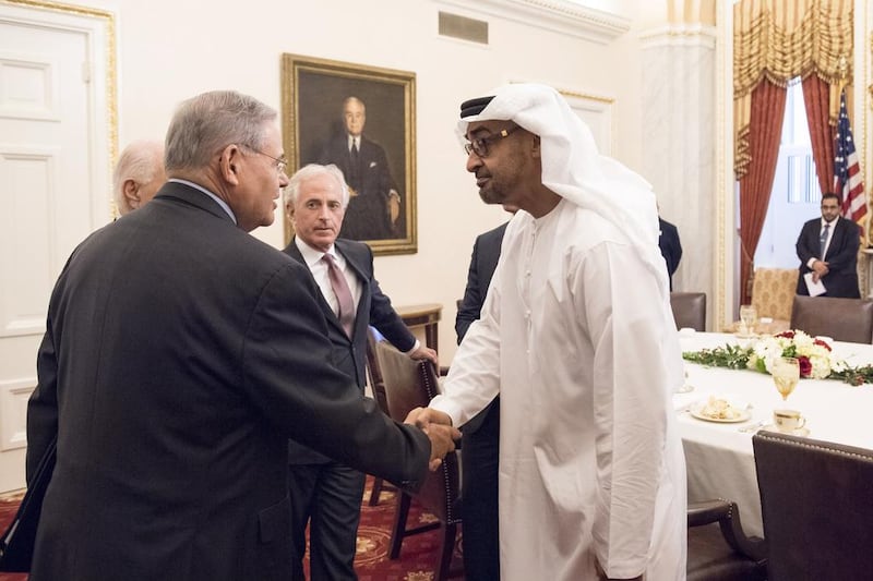 Sheikh Mohammed bin Zayed, Crown Prince of Abu Dhabi and Deputy Supreme Commander of the Armed Forces, greets Bob Menendez US Senator for New Jersey (L), prior to a lunch meeting at Capitol Hill. Seen with Bob Corker Chairman of the United States Senate Committee on Foreign Relations and Senator for Tennessee (back C). Rashed Al Mansoori / Crown Prince Court - Abu Dhabi )
