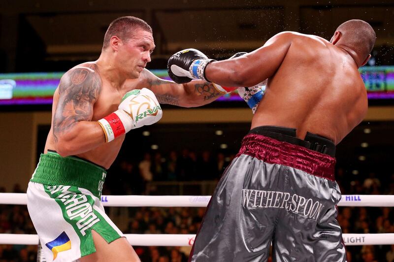 CHICAGO, ILLINOIS - OCTOBER 12: Oleksandr Usyk of Ukraine (L) lands a punch on Chazz Witherspoon in the third round of their Heavyweight bout at Wintrust Arena on October 12, 2019 in Chicago, Illinois.   Dylan Buell/Getty Images/AFP
== FOR NEWSPAPERS, INTERNET, TELCOS & TELEVISION USE ONLY ==
